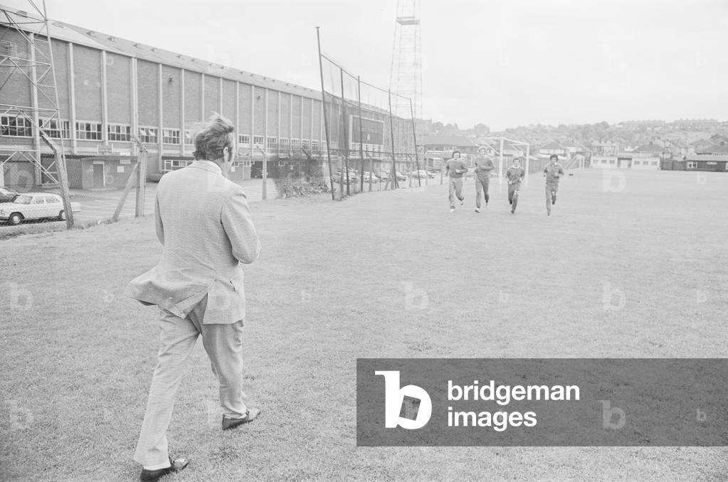 Don Revie Leeds United Manager seen here saying goodbye to some members of the team before leaving Elland Road for the final time before he takes up his appointment as England manager. 5th July 1974 (b/w photo)