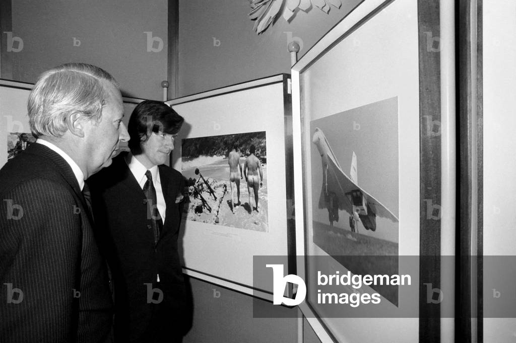 Mr. Edward Heath, leader of the opposition, congratulates Kent Gavin, Daily Mirror, after he was named British Press photographer of the year at the Europa Hotel, London. December 1969