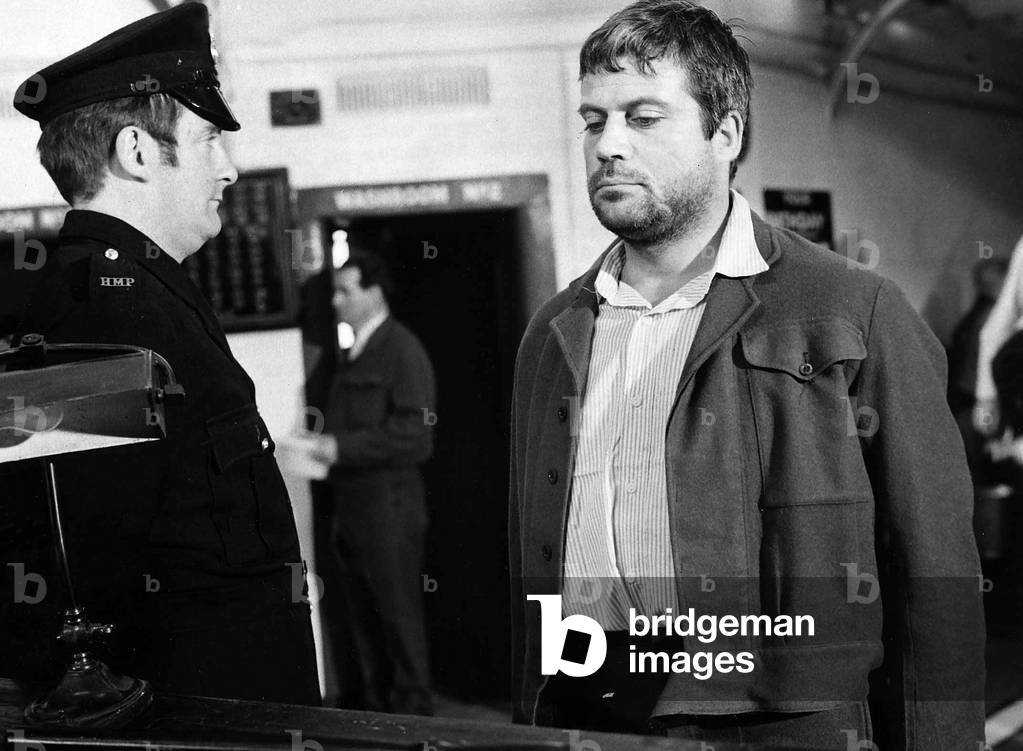 Oliver Reed British actor in film Sitting Target 1971
in jail facing prison warden