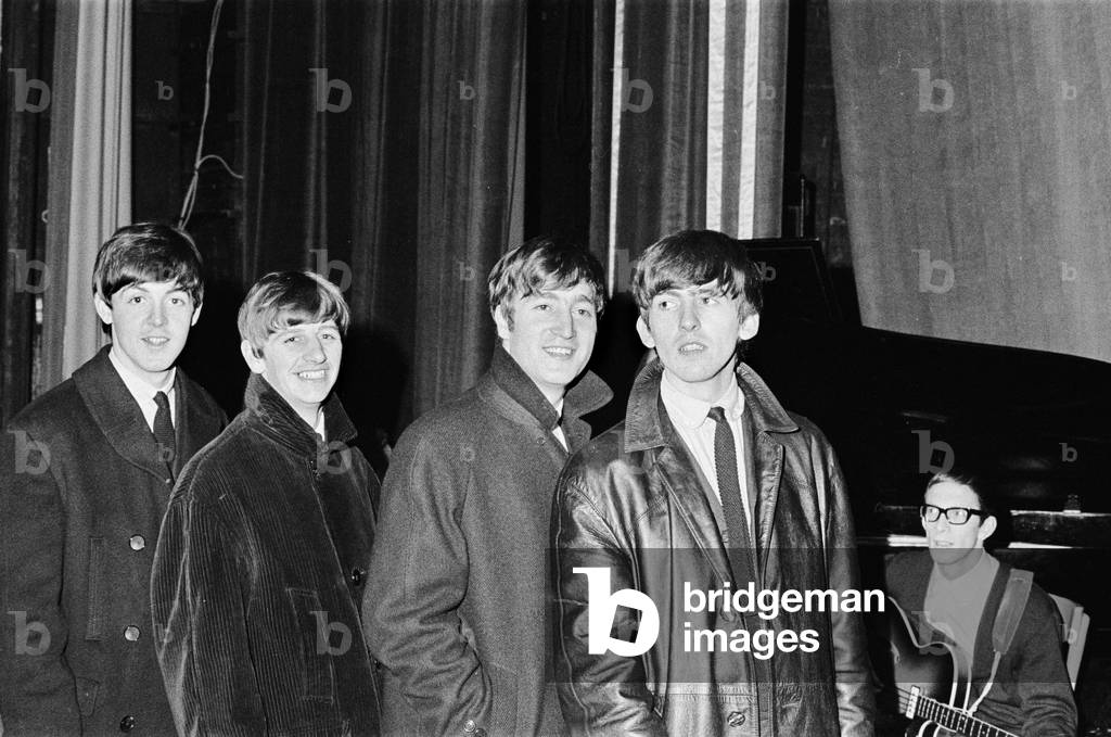 The Beatles pose for the cameras at the Odeon Cinema in Cheltenham. 1st November 1963 (b/w photo)