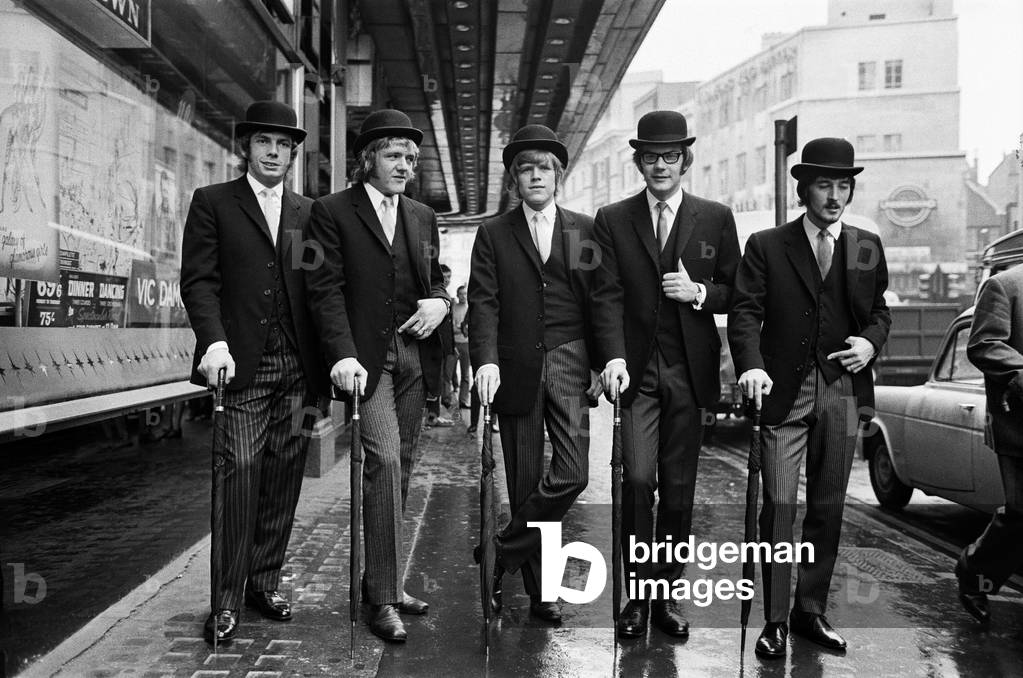 British pop group Hermans Hermits led by singer Peter Noone are to be the first ever all pop group to apper at London's Talk Of The Town. Here the group are pictured outside dressed up for rehearsals. 18th September 1969 (b/w photo)