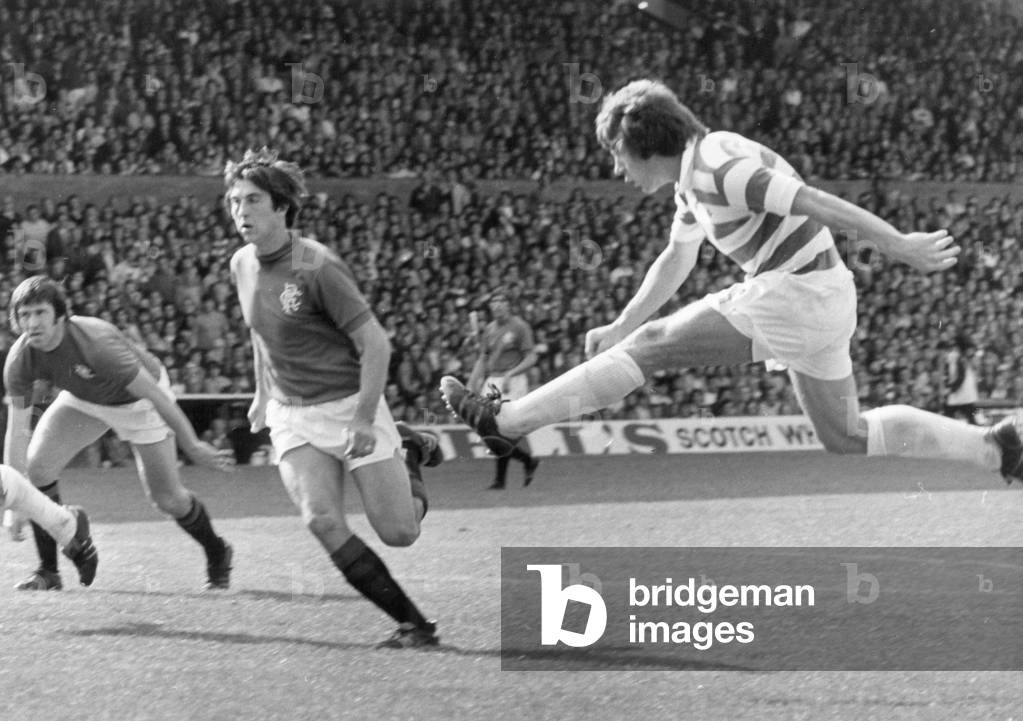 Celtic v Glasgow Rangers league match at Celtic Park September 1976. Celtic's Ronald Glavin shoots for goal past John Greig of Rangers (left) and Tom Forsyth (centre) (photo)