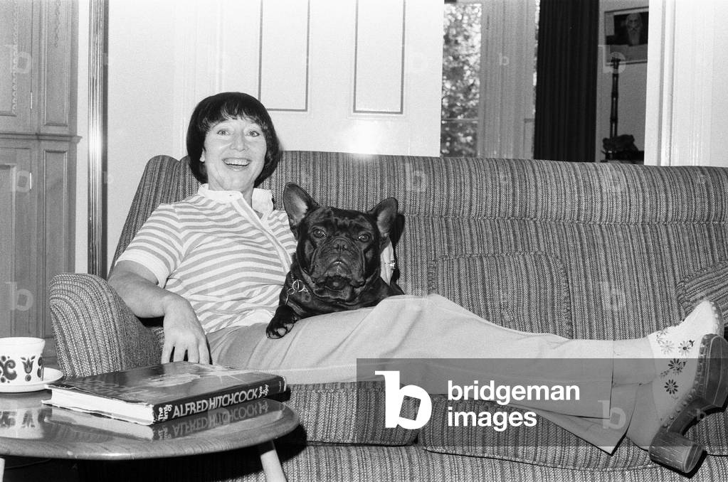 Patsy Wilcox former wife of TV producer Desmond Wilcox seen here in her London home with her dog Toby. 23rd June 1977 (b/w photo)