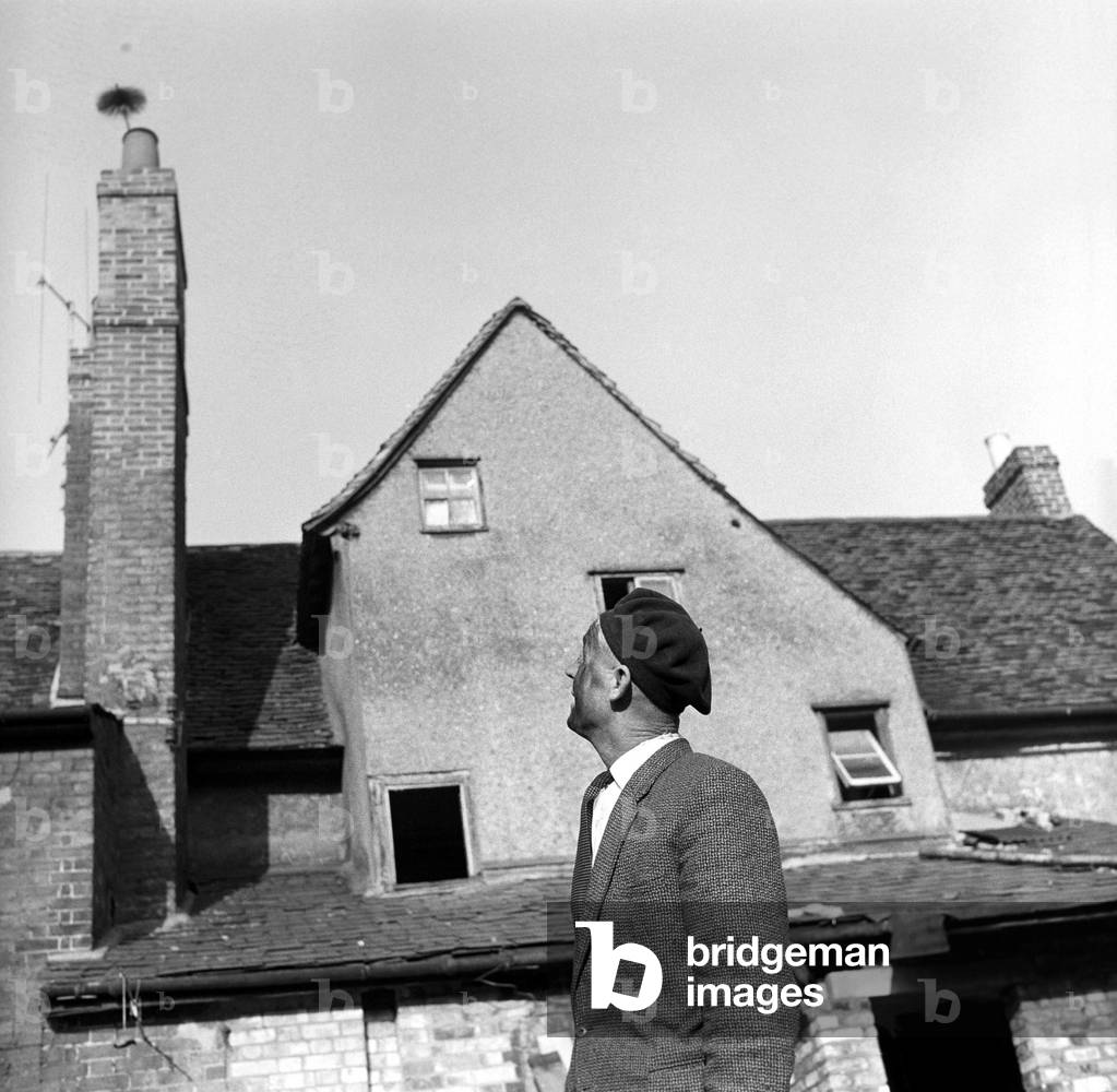 Chimney sweep (Ronald Neal) seen here at work, 1967 (b/w photo)