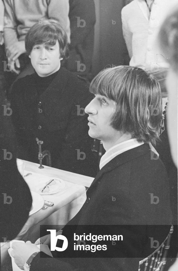 Ringo Star and John Lennon of the Beatles seen here at a reception for the band. June 1965 (b/w photo)