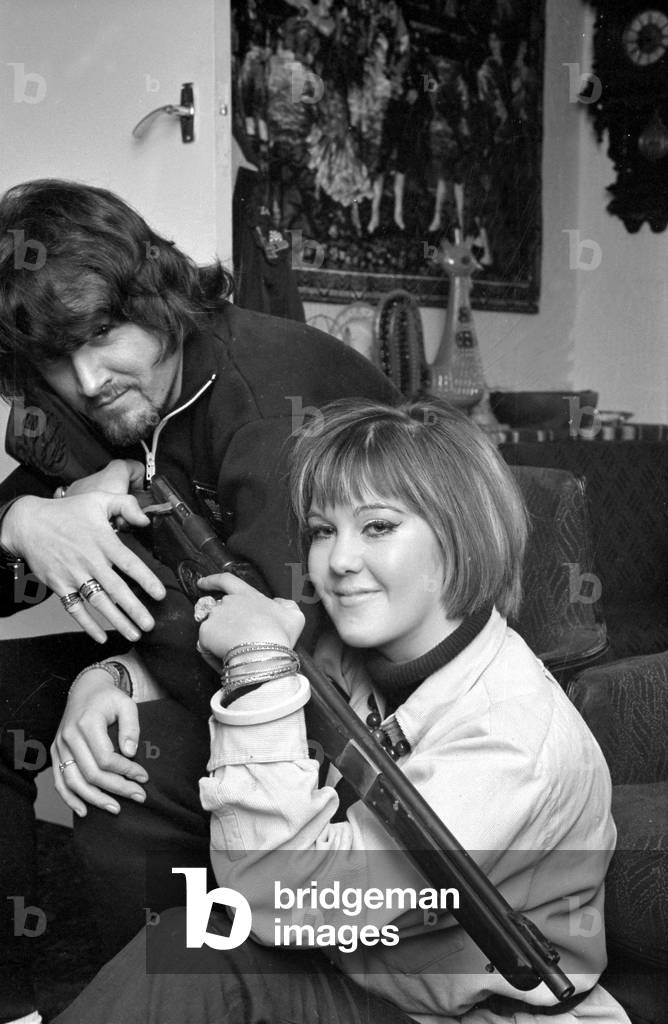 30 year old pop star P.J Proby announced his engagement to British actress Vanessa Forsythe. He has two problems however, he is £84,000 in debt and is unsure of the legal standing with his two previous wives. OPS P.J Proby and Vanessa Forsythe at his Hendon home with one of his ornamental guns, November 1968
