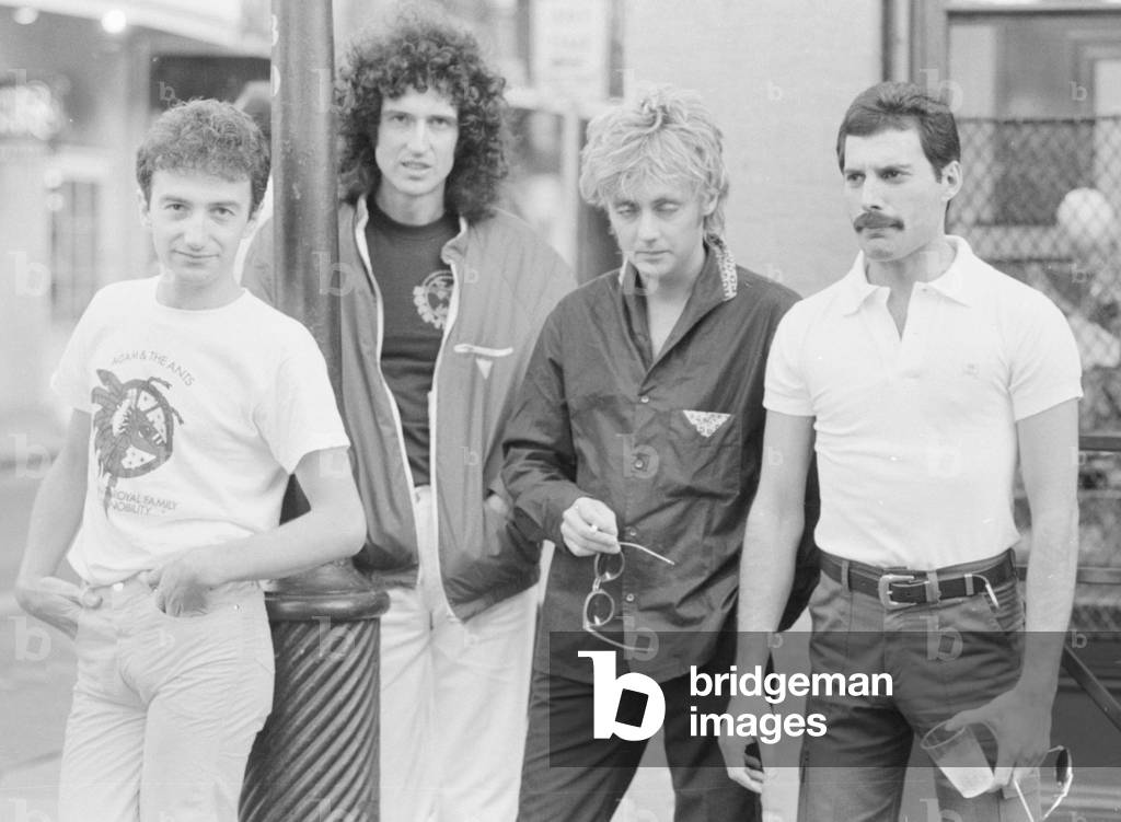 Queen Left to Right John Deacon, Brian May, Roger Taylor and Freddie Mercury seen here relaxing on the streets of New Orleans, USA. The band are in the States rehearsing before embarking on a tour of South America, 21st September 1981 (b/w photo)
