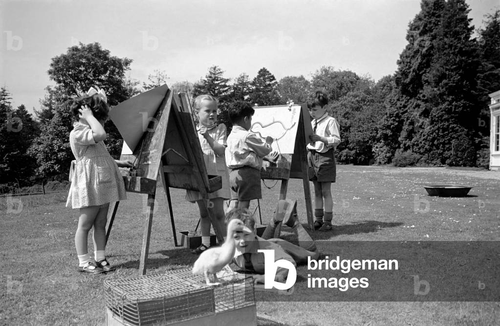 Children at Crarleigh L. C. C. Residential Nursery School look after their pet ducklings.