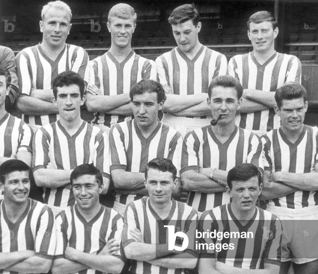 Practical joker Brian Clough makes his team mates laugh on trhe offical Sunderland group photograph with a pipe in his mouth August 7th 1961 (photo)
