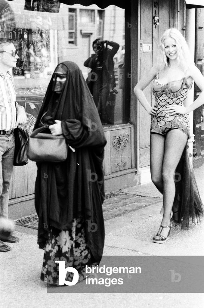 Model Jo Howard wearing the original costume worn by Marilyn Monroe in the film 'Bus Stop', which was auctioned at Christies in South Kensington today for £380.00, pictured August 1975 (b/w photo)