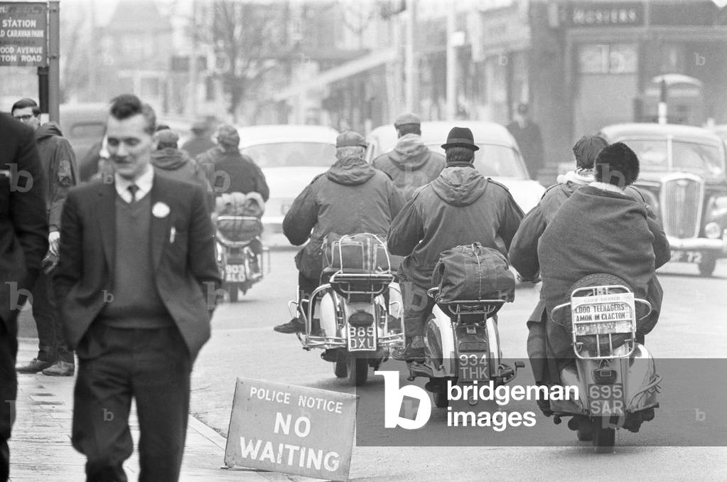 Mods on their scooters seen here leaving Clacton at the end of the bank holiday weekend. Over the 1964 Easter weekend several scuffles between Mods and Rockers broke out in the Essex seaside town. 30th March 1964 (b/w photo)
