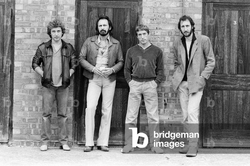 Members of the British rock group The Who pose for pictures after new drummer Kenney Jones joined the band replacing Keith Moon. Left to right; new drummer Jones, bass guitarist John Entwistle, singer Roger Daltrey and guitarist Pete Townshend. 12th August 1979 (b/w photo)