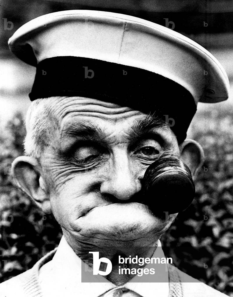 One of the faces of champion gurner Dai Llewellyn, of Mountain Ash, now aged 82 but gurning as well as ever 
August 1978