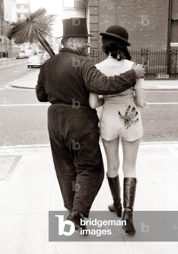 This chimney sweeper left his mark on the young lady, 1960 (b/w photo)