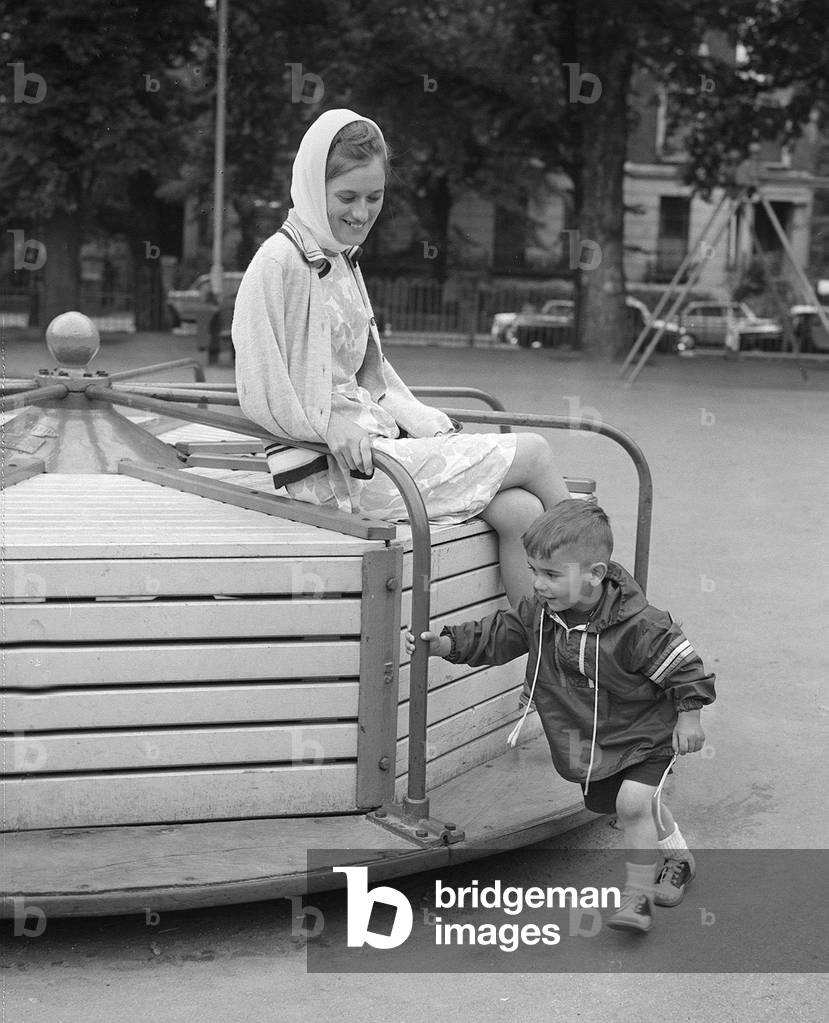 Judy Nauyokas with her son Richard aged 2 and a half whom she snatched back from her estranged husband in America, 9th July 1965 (b/w photo)