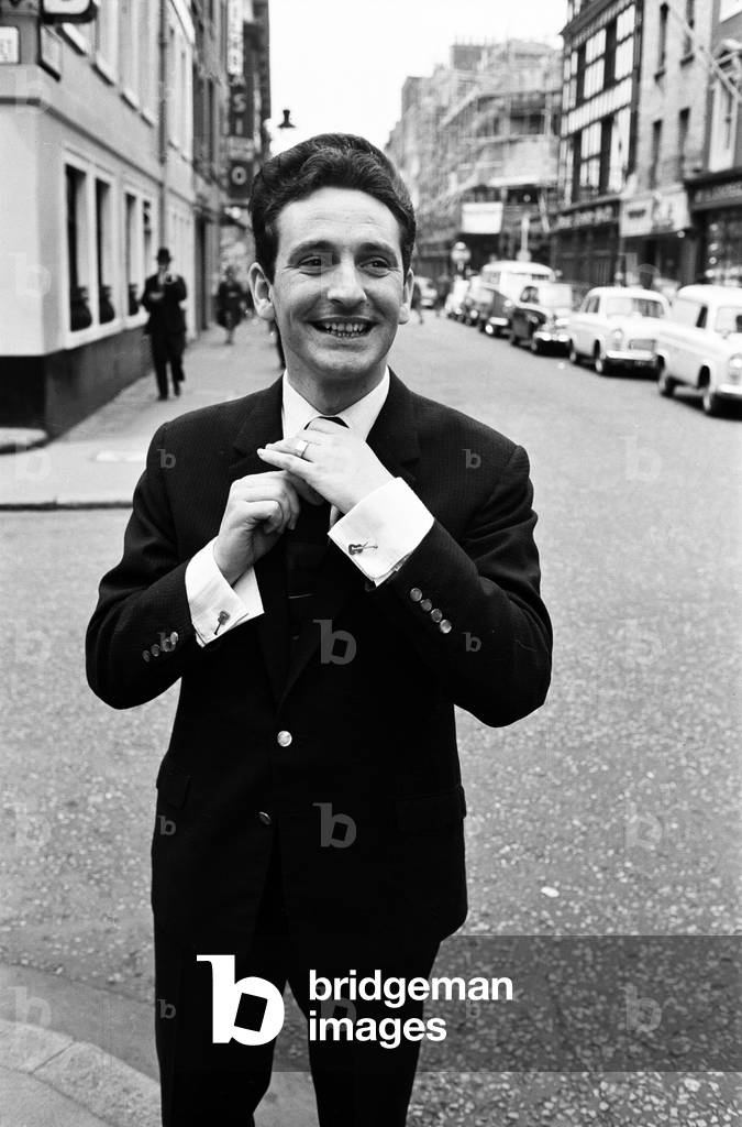 Skiffle King Lonnie Donegan, might sing about his old man being a dustman. But today experts decided that Lonnie himself was a very smart man. He has just been presented with an award for being one of Britain's ten best dressed men. The award was presented by the Wholesale Clothing Manufacturers Federation, Monday 4th July 1960 (b/w photo)