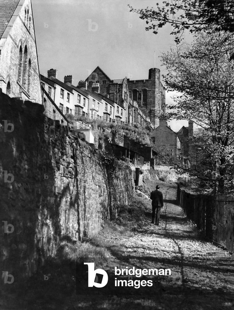 Man walking along the path by Bangor University. 
April 1949