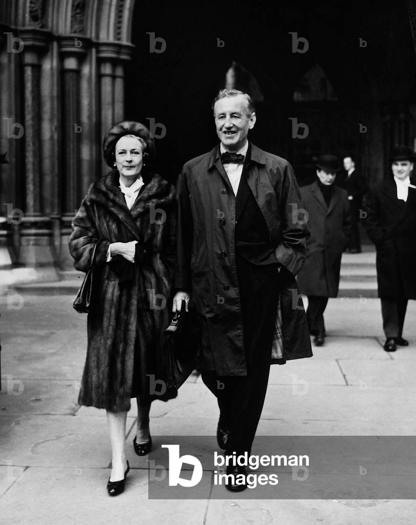 The writer Ian Fleming with his wife Ann, infront of the Royal Courts of Justice, London, 3rd December 1963 (b/w photo)