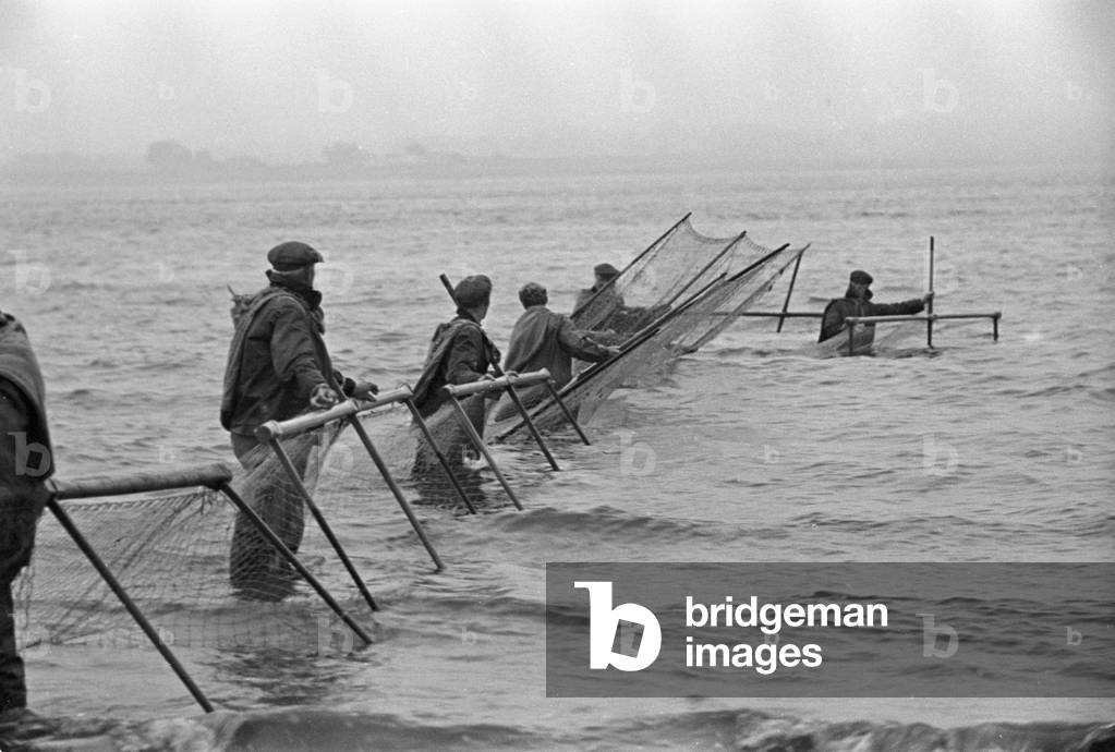 August 1947 - Fisherman from Annan seen here preparing to fish the Solway Firth for salmon, trout and sea trout (photo)