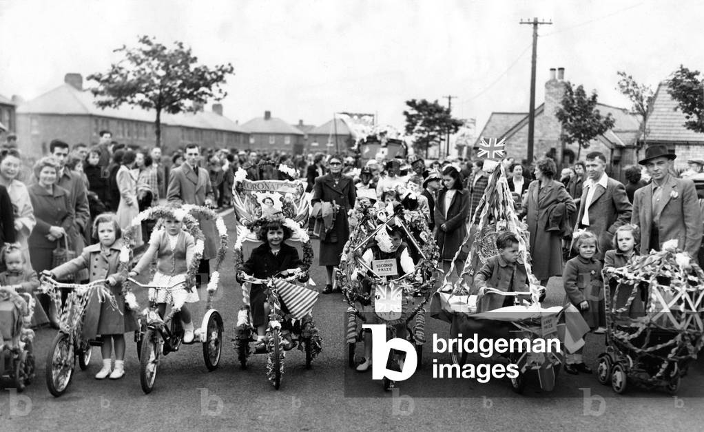 Queen Elizabeth II, Princess Elizabeth - Coronation - Children enjoy a bicycle race at their North East street party, 1950 (b/w photo)