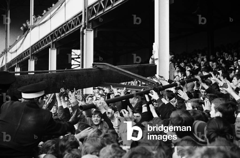 English League Division One match at Goodison Park. Everton 1 v Liverpool 0. St Johns Ambulancemen with collapsed steel girder taken from the stands during the match with Liverpool. 3rd February 1968 (photo)