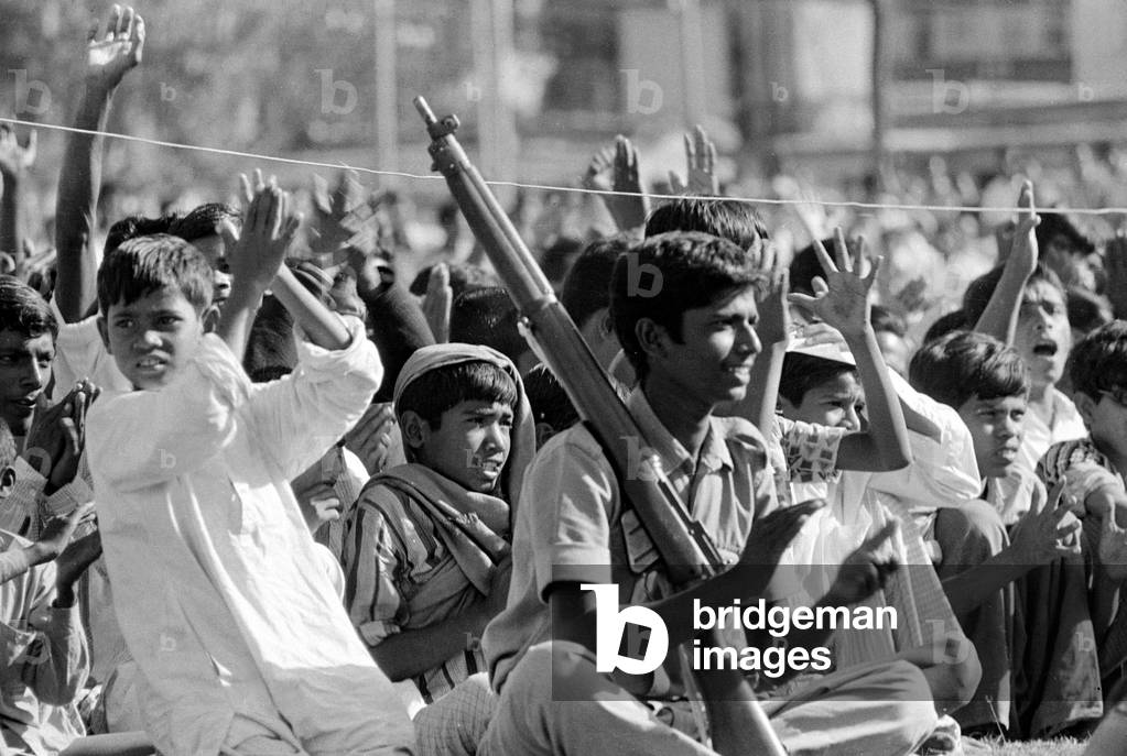 Refugee children waiting in ration lines at the Sahara Dum Dum refugee camp on the road to Barasat. The camp already over crowded at this point in the war had to refuse newcomers ration cards, 13/06/1971 (b/w photo)
