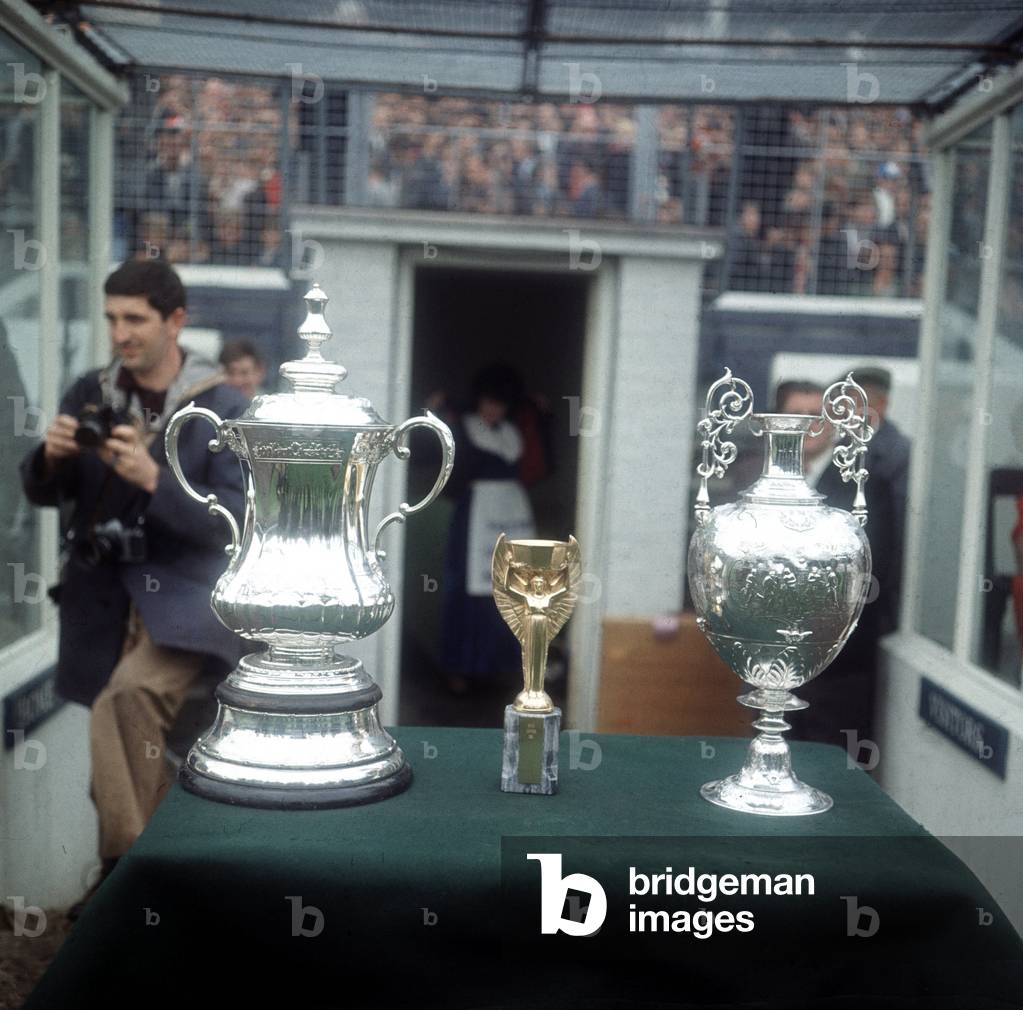 FA Charity Shield match at Goodison Park. Everton 0 v Liverpool 1. The three trophies won last season on display inside the stadium. The FA Cup (left) was won by Everton while Liverpool won the league championship trophy (right). The Jules Rimet World Cup trophy was also displayed to fans as the victorious England team featured Roger Hunt of Liverpool and Ray Wilson of Everton. 13th August 1966 (photo)