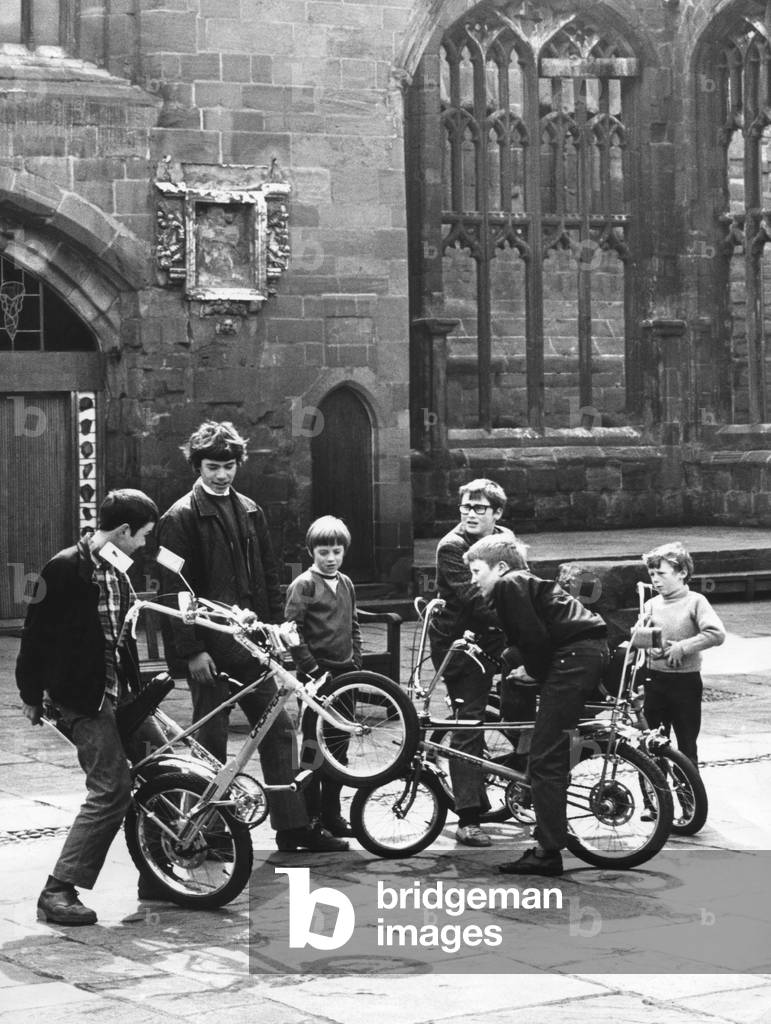 These youngsters looked everywhere for a place to ride their bikes, then found it right in the middle of Coventry. It's flat, without too many people and no traffic - the cathedral ruins. But the cathedral authorities frown on it. 