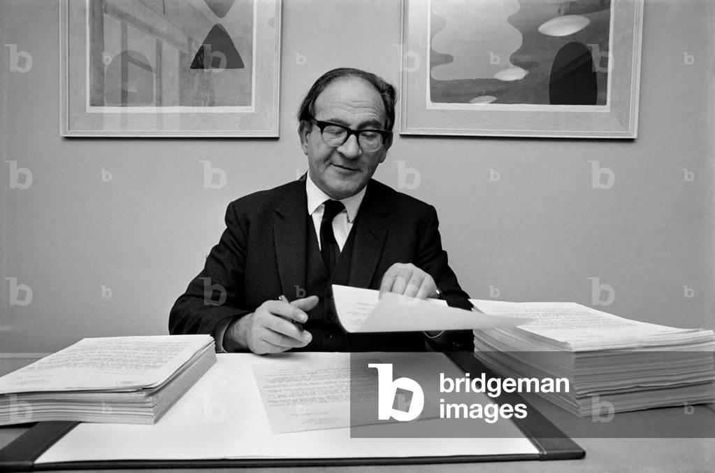 Mr. Fred Mulley, Minister of Transport is sending a personal letter to over 800 newspaper editors throughout the country about road safety at Christmas. Each one is individually signed by Mr. Mulley . The minister at his desk in the Ministry with a pile of letters already signed, and another pile waiting for signature. November 1969