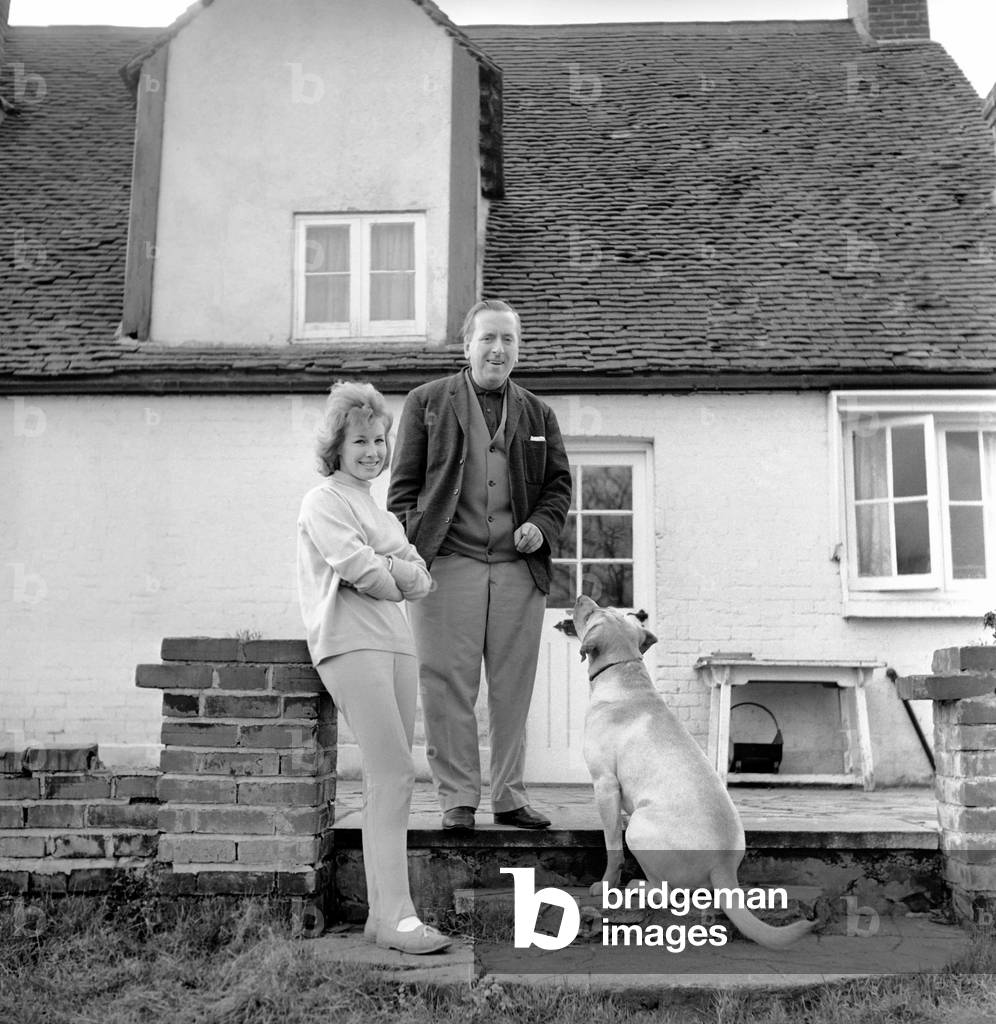 TV actor Hugh Lloyd seen here at home with his wife and pet dog, 1960 (b/w photo)