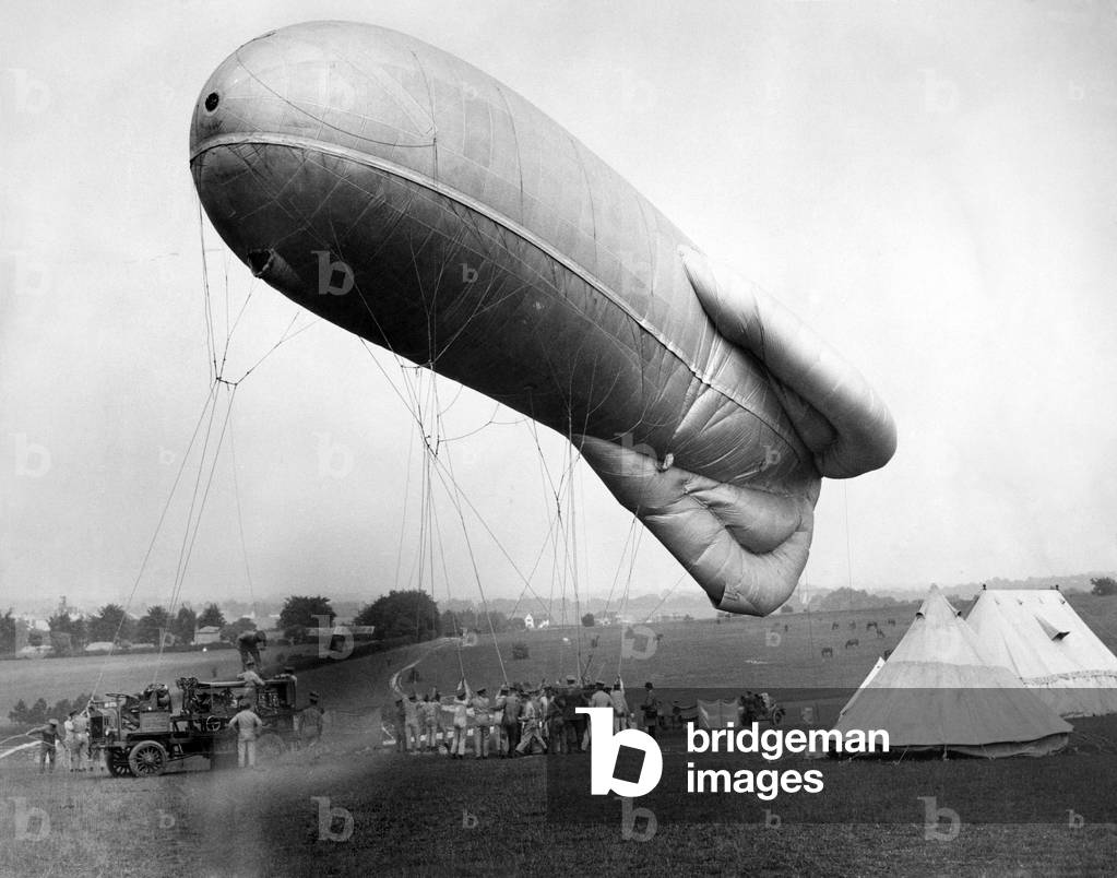 Observation balloon seen here being inflated at Epsom race course by members of the military. June 1924
