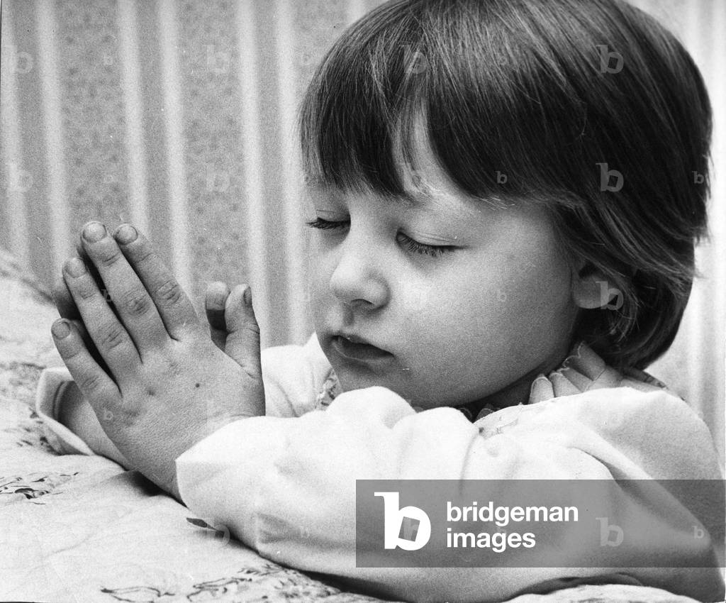 Young Denise Woodhouse praying like a little angel. C. 1970