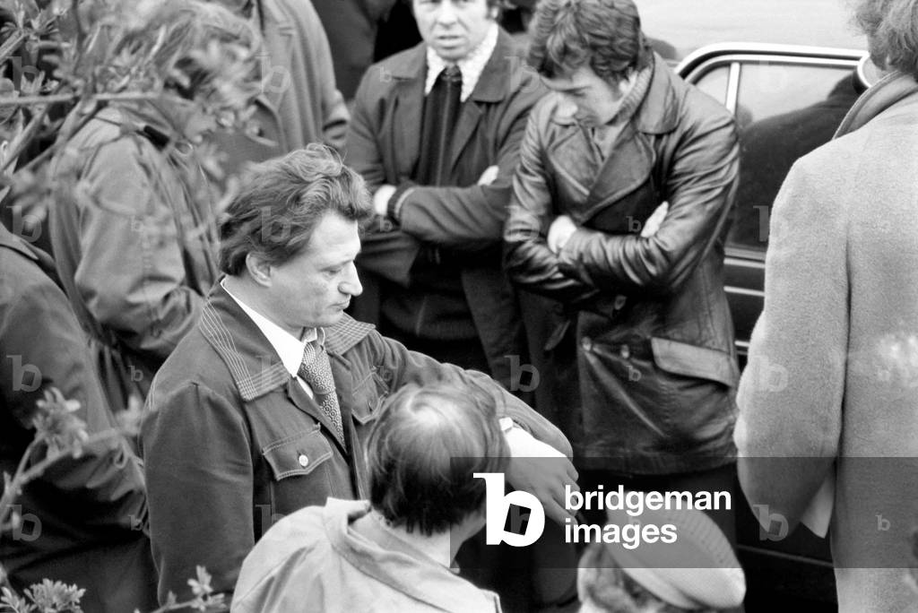 About 8,000 dockers voted to continue their strike this morning with a unanimous show of hands at their meeting at Connaught Corner, E15. Union official Billy Powell and Brian Nicholson, March 1975 (b/w photo)