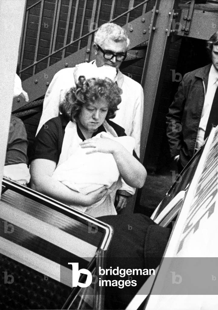 Sister Brown carries Louise Brown ( the World's first test tube baby) to the waiting ambulance
August 1978