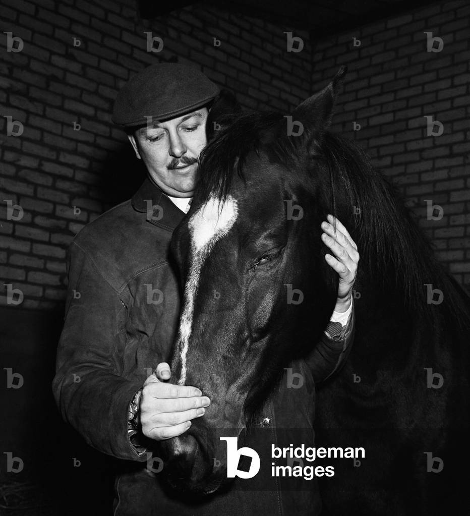 Freddie Laker at Woodcote Park Stud Farm near Epsom in Surrey. 27th January 1960 (b/w photo)