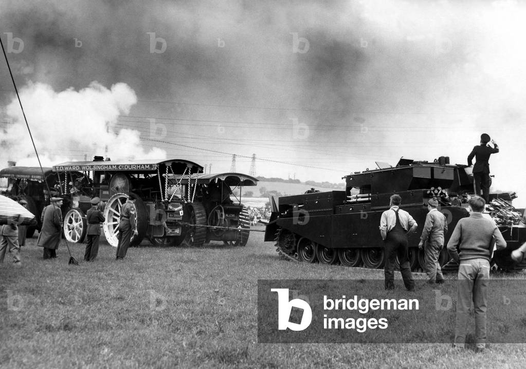 Traction engines and a tank having a tug of war at a Steam Rally on 10th June 1961 (b/w photo)