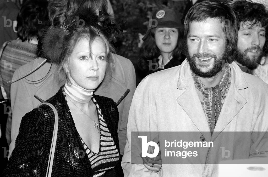 Some of the stars who attended the premiere of the Ken Russell film 'Tommy' at the Leicester Sq. Theatre last night. Eric Clapton with girlfriend Patti Boyd, March 1975 (b/w photo)