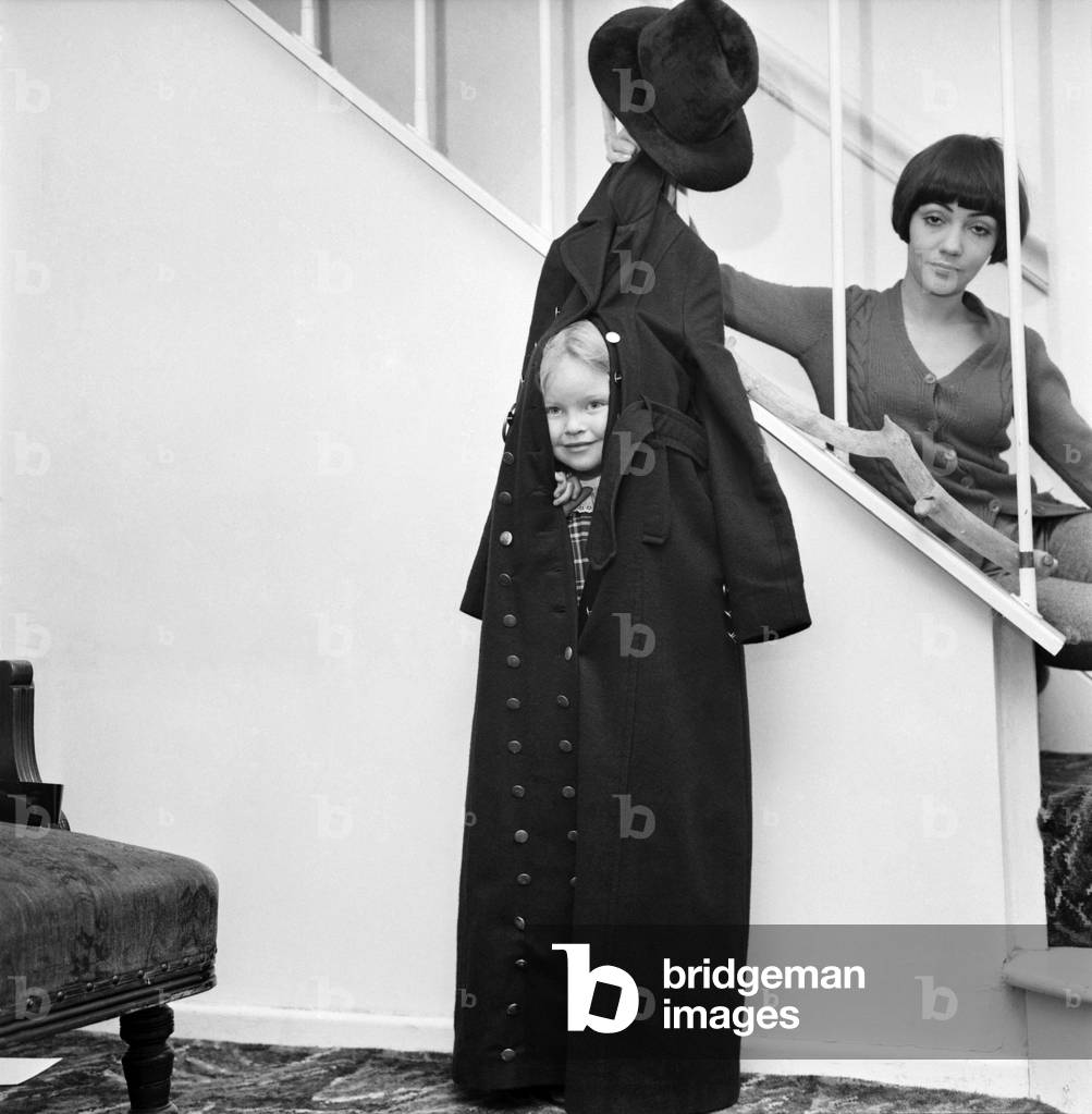 Clothing fashion. Model Ann Coates wearing a maxi coat. December 1969