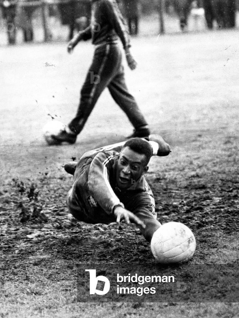 Brazilian football star Pele takes a turn in goal in a training session at Bolton during the 1966 World Cup tournament in EnglandJuly 1966 (photo)