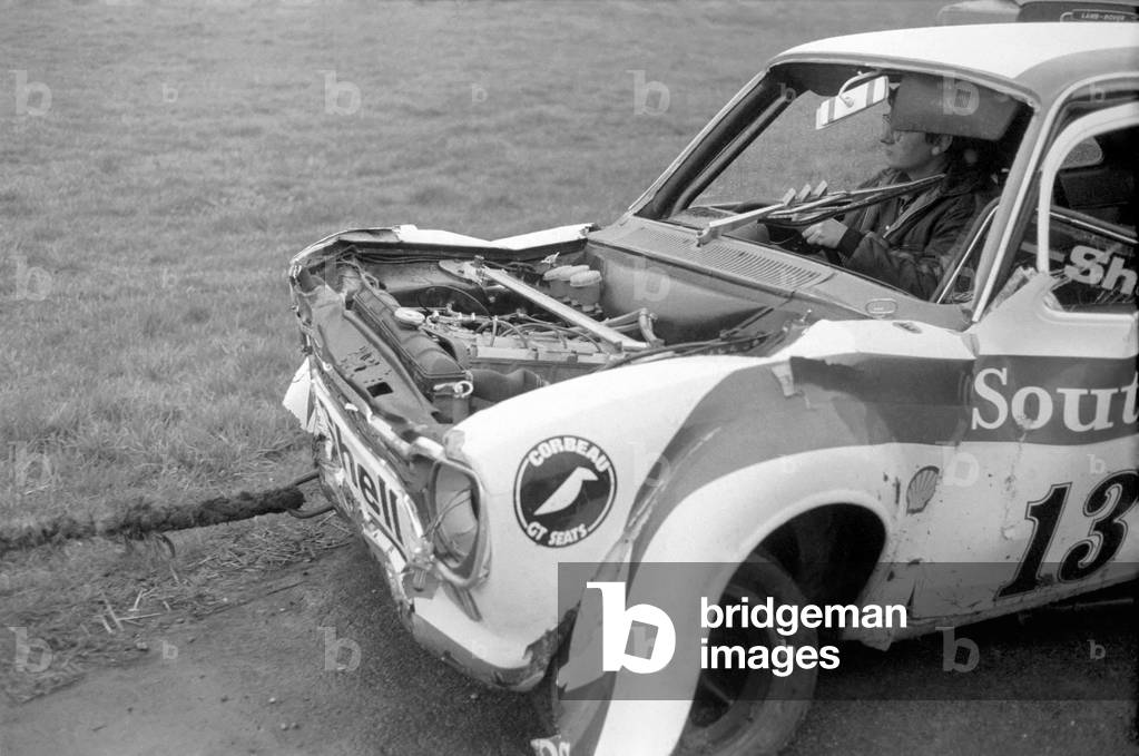 Britain's ex-ski champion Divina Galicia crashed her £6000 car on the second lap of her very first professional race at Brands Hatch today, 2nd February 1975 (b/w photo)