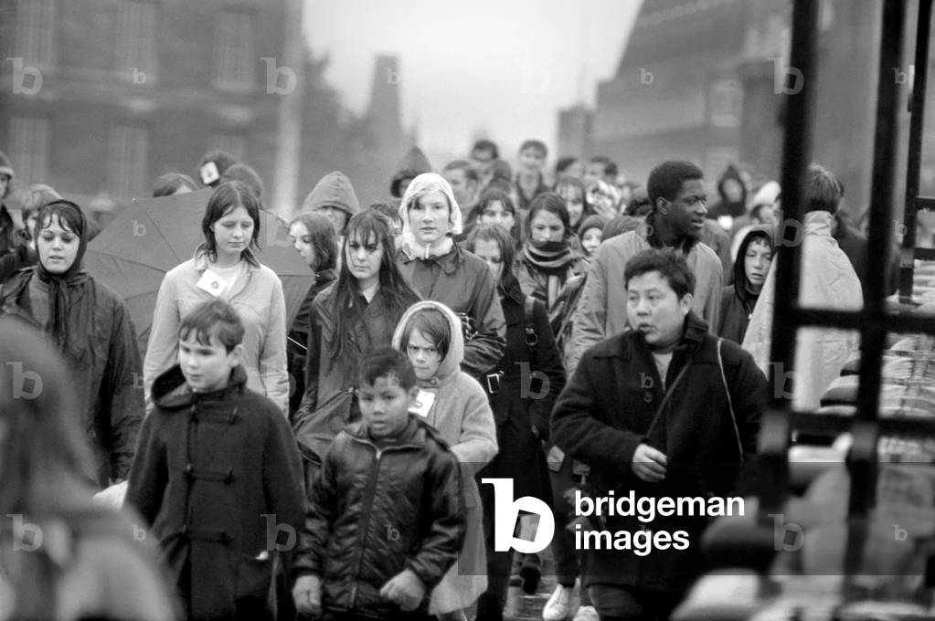 The 5th London Bridges Walk organised by the British Council for Rehabilitation of the Disabled had a total of over 17; 500 entrants before its start today. The sponsored walkers will travel over a 20 mile course crossing each London bridge between Kew Bridge and London Bridge.
Long line of walkers passing over Westminster Bridge. November 1969