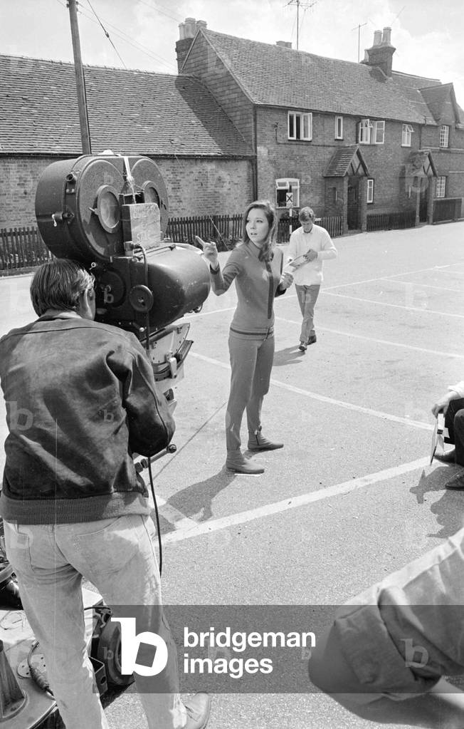 Diana Rigg during the filming of The Avengers at Aldbury. film set August 1967 (b/w photo)