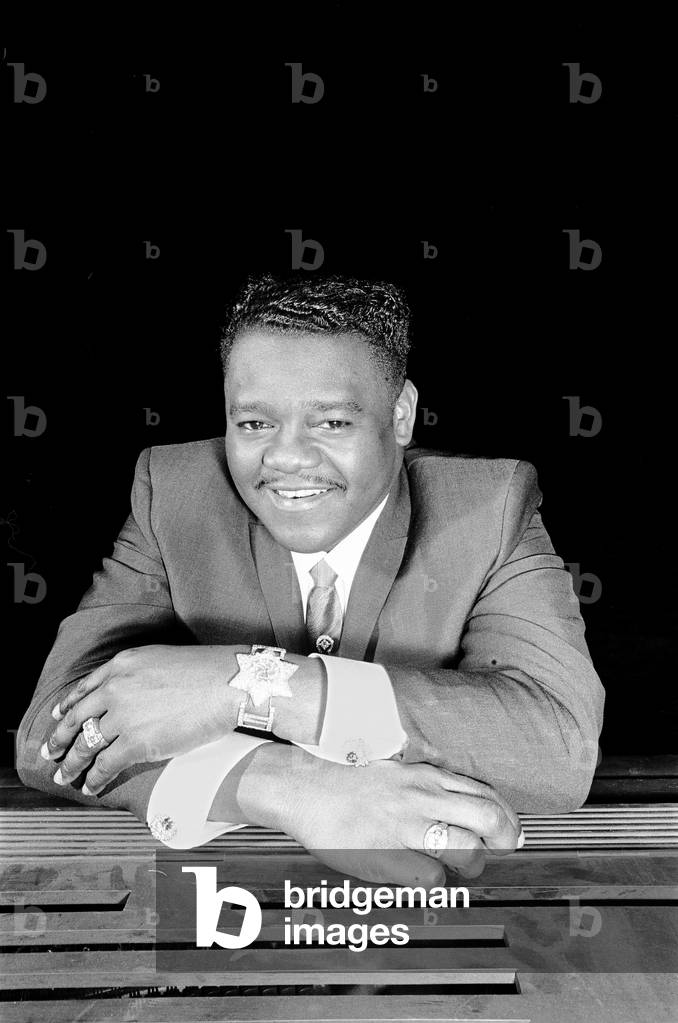 American rock and roll star Fats Domino at the piano on the stage of the Saville Theatre in London as he prepares for the evening show with Gerry and The Pacemakers. This is his first performance in Britain. 27th March 1967 (b/w photo)