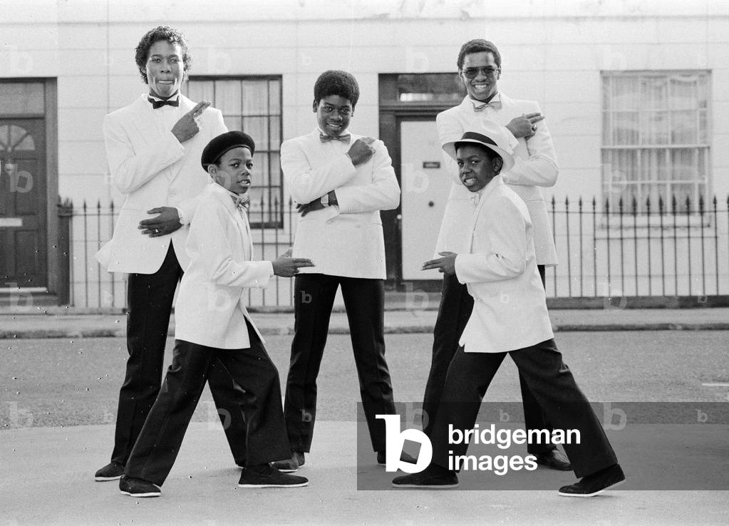 Musical Youth, British Jamaican pop / reggae group, who are currently recording the video for their latest single titled '007', pictured 10th October 1983 (b/w photo)