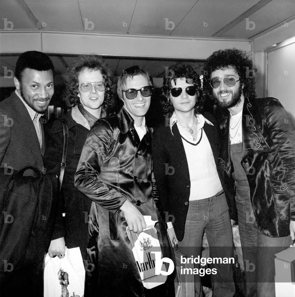 Steve Harley (3rd left) and Cockney Rebel. Seen here at London Airport arriving back from New York, 26/02/1975
