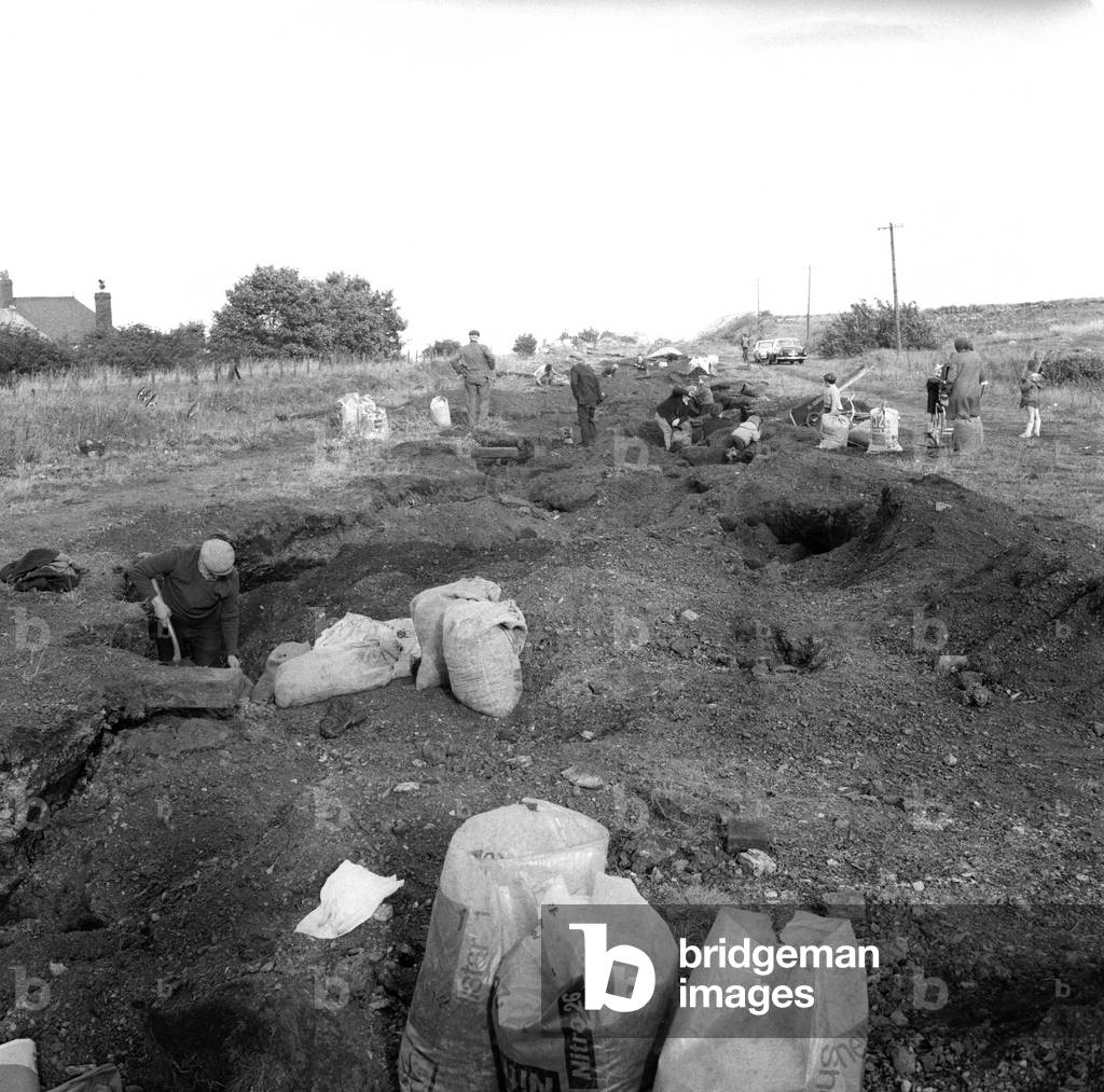 The people of Craghead in County Durham are taking the chance of a bit of free coal by digging down into the slag heaps around the village on 10th October 1969.
 Coal diggers young and old join in.
