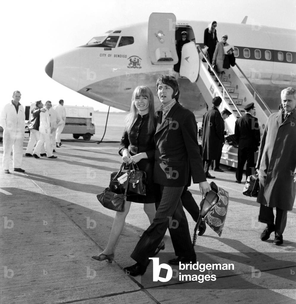 Paul McCartney of the Beatles and Jane Asher at Heathrow today. March 1968 (b/w photo)