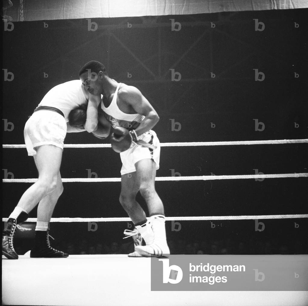Amateur boxing match between the USA and England at Wembley. Action from the bout between Johnny Cesspooch (USA) and Peter Benneyworth (England) 2nd November 1961 (b/w photo)