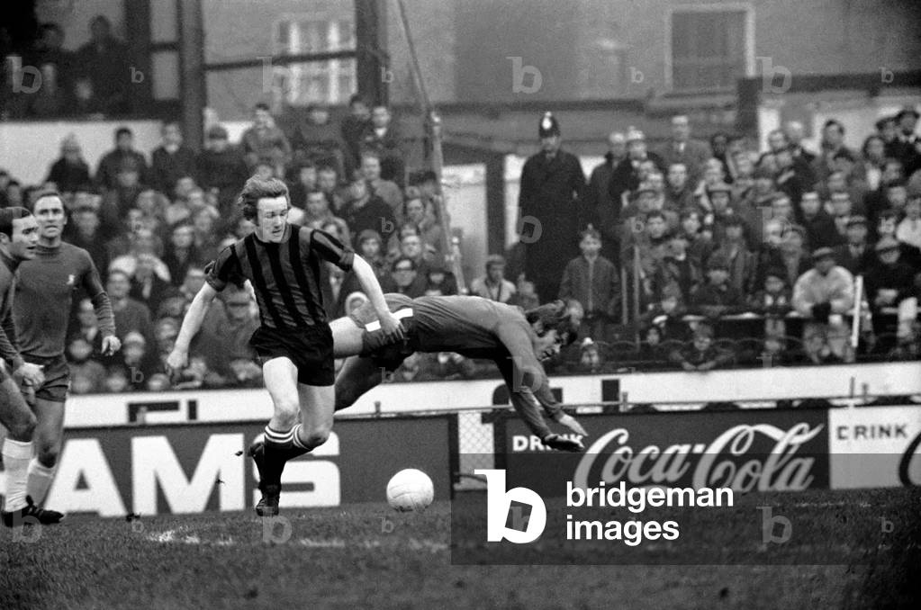 English Leaque Division One Football 1969/70 Season Chelsea v Manchester City. The final score was a three one victory to Chelsea. Chelsea fullback taking the dive is David Webb Chelsea's two goal hero. This time he was beaten by City winger Bowyer. December 1969 (photo)