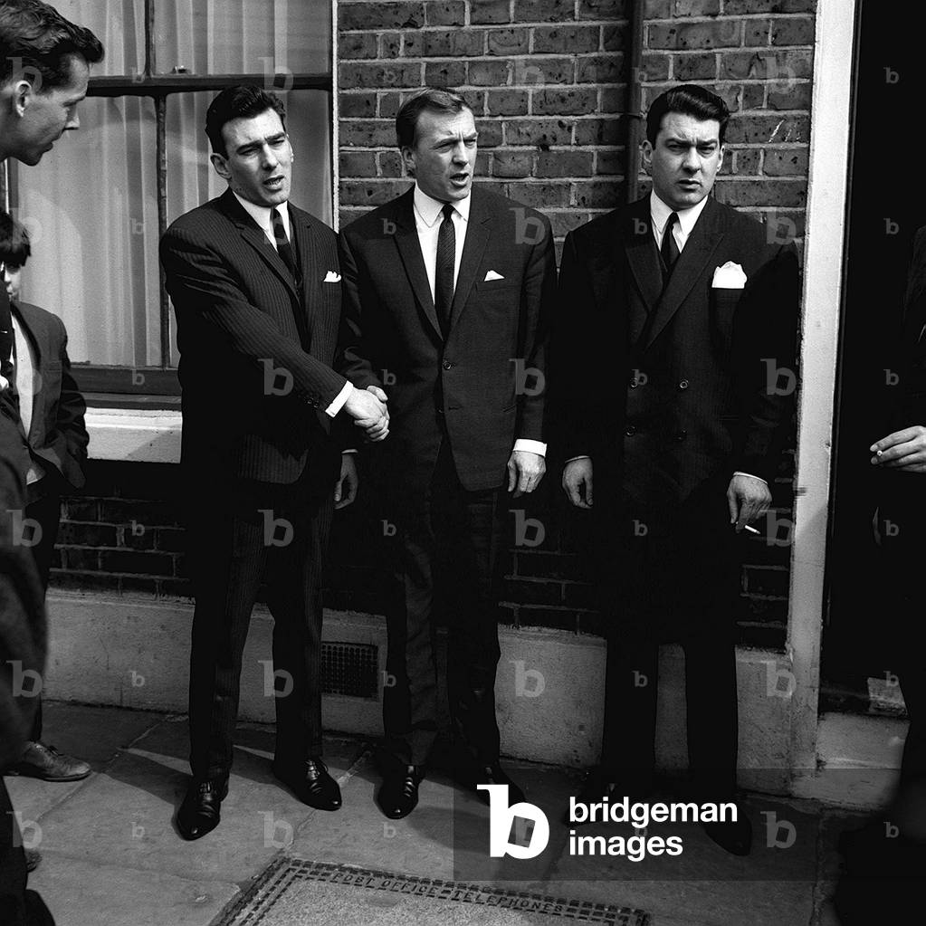 Kray Brothers Left to Right Reginald Kray, Charlie Kray and Ronald Kray outside their families house in Valance Road London's East End after the twins Reggie and Ronnie were discharged by a Old Bailey Jury after the judge stopped the trial, 05/04/1965 (b/w photo)
